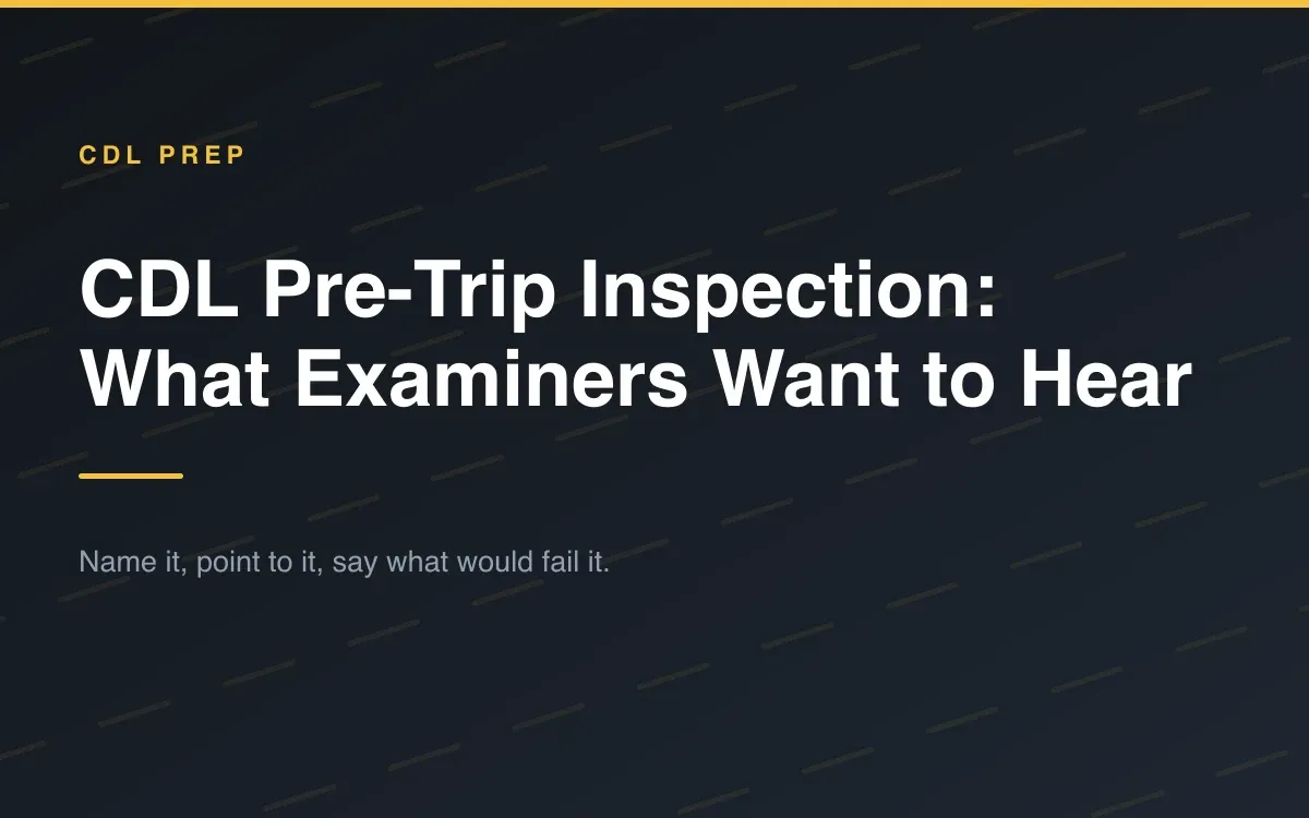 A driver pointing at the steer axle of a tractor-trailer while talking through a pre-trip inspection